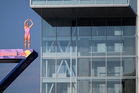Red Bull Cliff Diving World Series: Molly Carlson of Canada acknowledges the crowd from the 21 metre platform